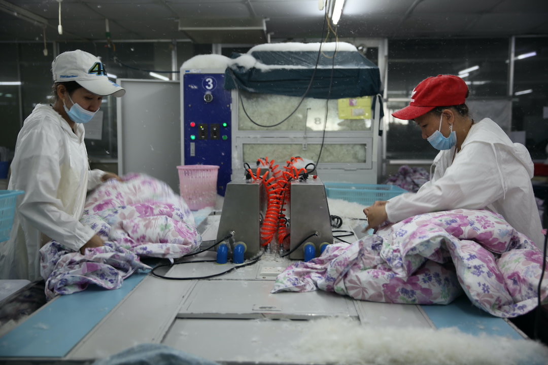 two garment workers using responsible down